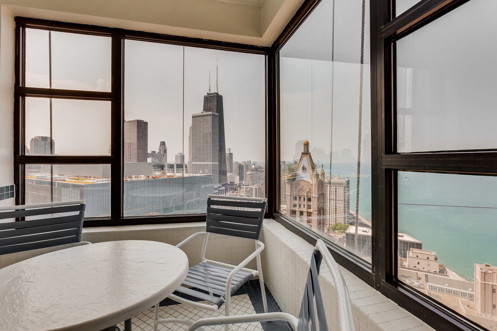 401 East Ontario Street, Unit 710 Chicago, IL 60611 - Photo 32 of 36 a kitchen with a large window and furniture