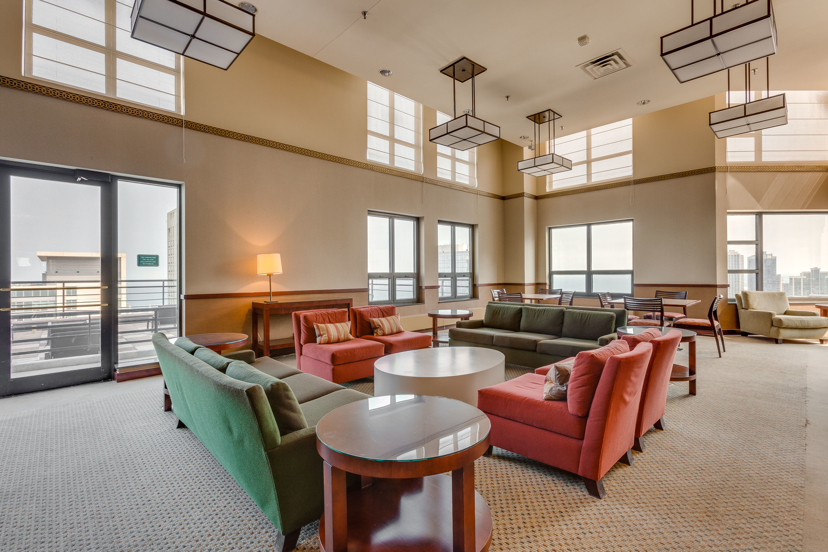 401 East Ontario Street, Unit 710 Chicago, IL 60611 - Photo 34 of 36 a living room with furniture a chandelier and a large window