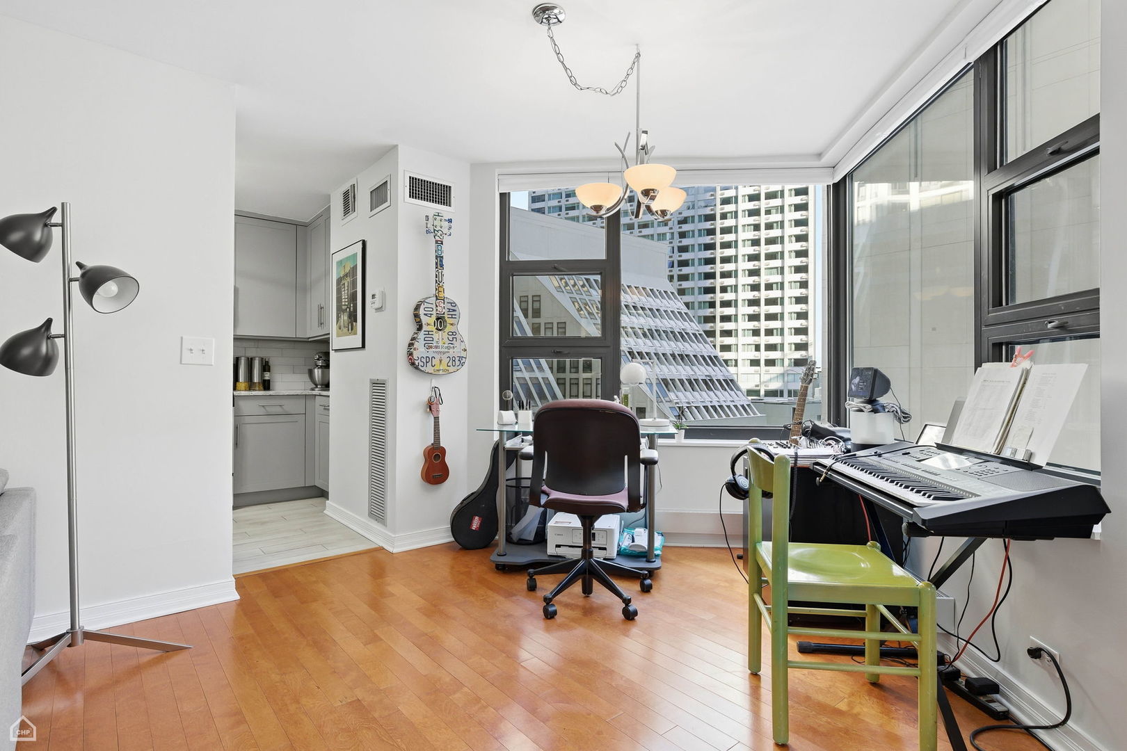 401 East Ontario Street, Unit 710 Chicago, IL 60611 - Photo 6 of 36 a view of a livingroom with workspace and a window