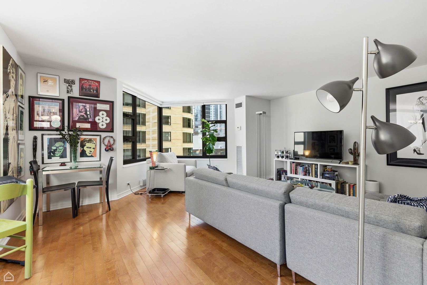 401 East Ontario Street, Unit 710 Chicago, IL 60611 - Photo 8 of 36 a living room with furniture and a flat screen tv