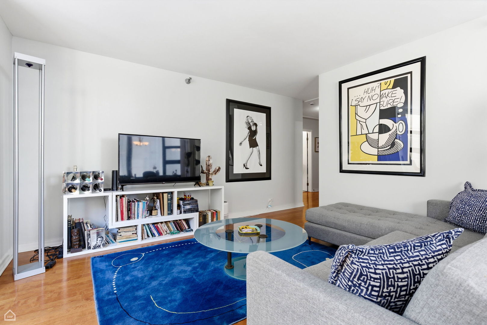 401 East Ontario Street, Unit 710 Chicago, IL 60611 - Photo 10 of 36 a living room with furniture and a flat screen tv