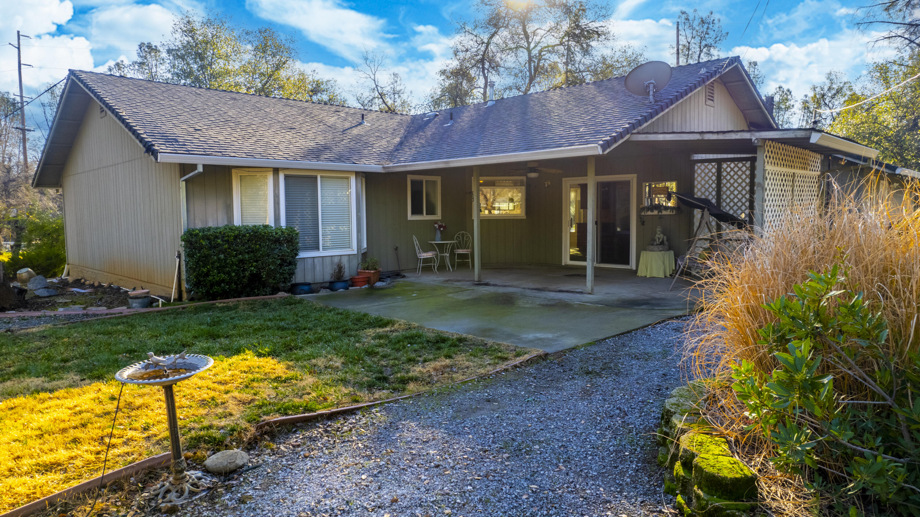 11627 Nash Road Redding, CA 96003 - Photo 35 of 41 a front view of a house with garden