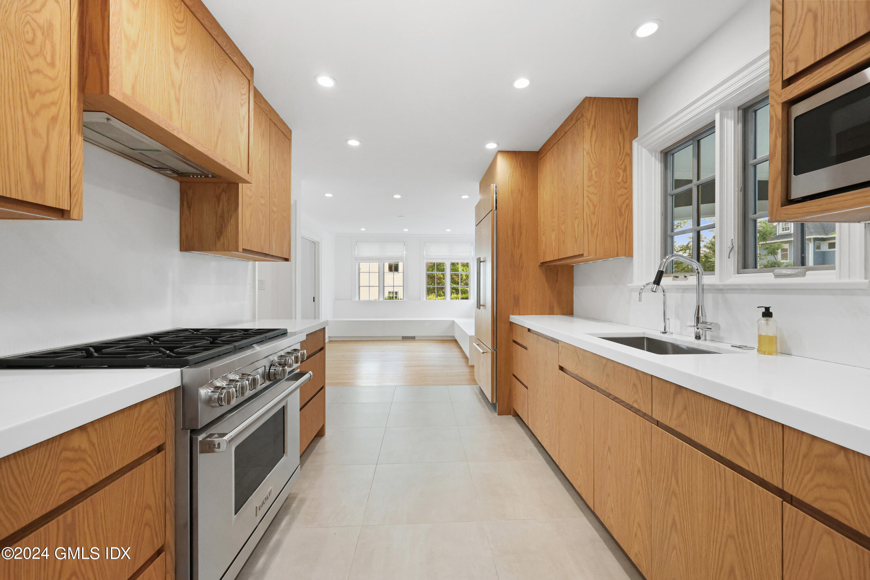 6 Benedict Place Greenwich, CT 06830 - Photo 6 of 16 a large kitchen with stainless steel appliances granite countertop a lot of counter space and a sink