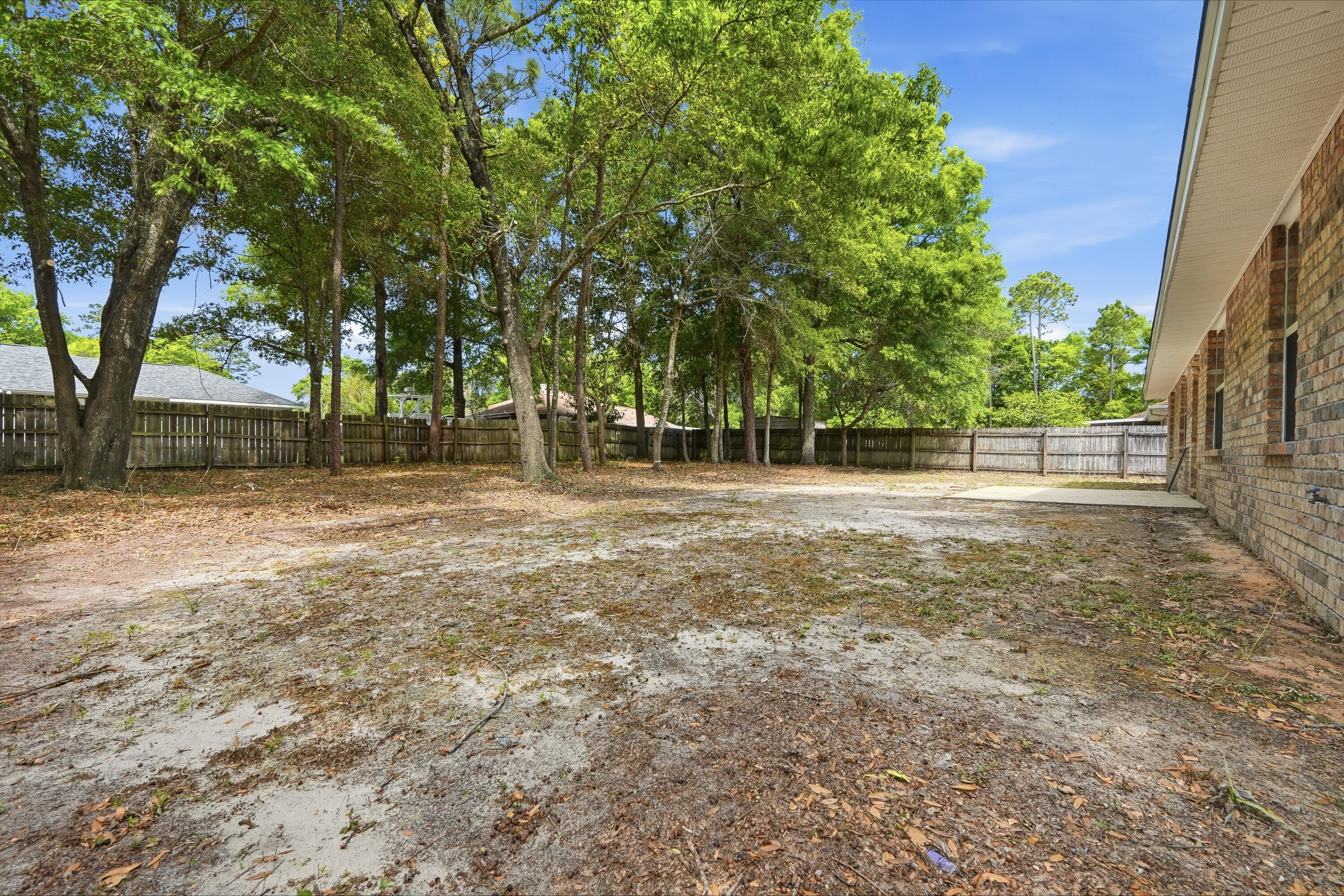 4087 Audiss Road Milton, FL 32583 - Photo 33 of 34 a view of a field with trees in the background