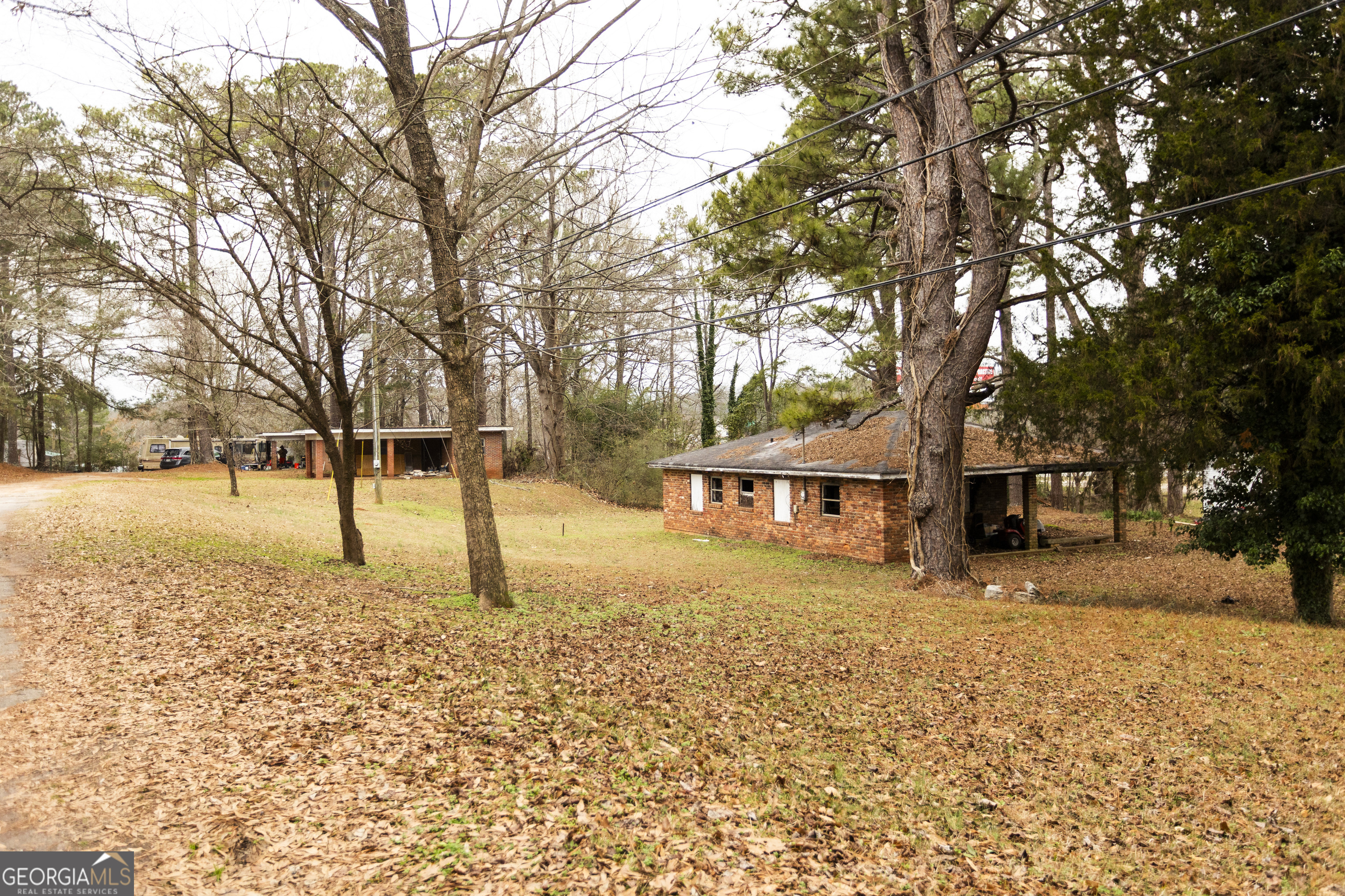 20 East Dollar Circle Covington, GA 30014 - Photo 12 of 31 a tree in the middle of a yard