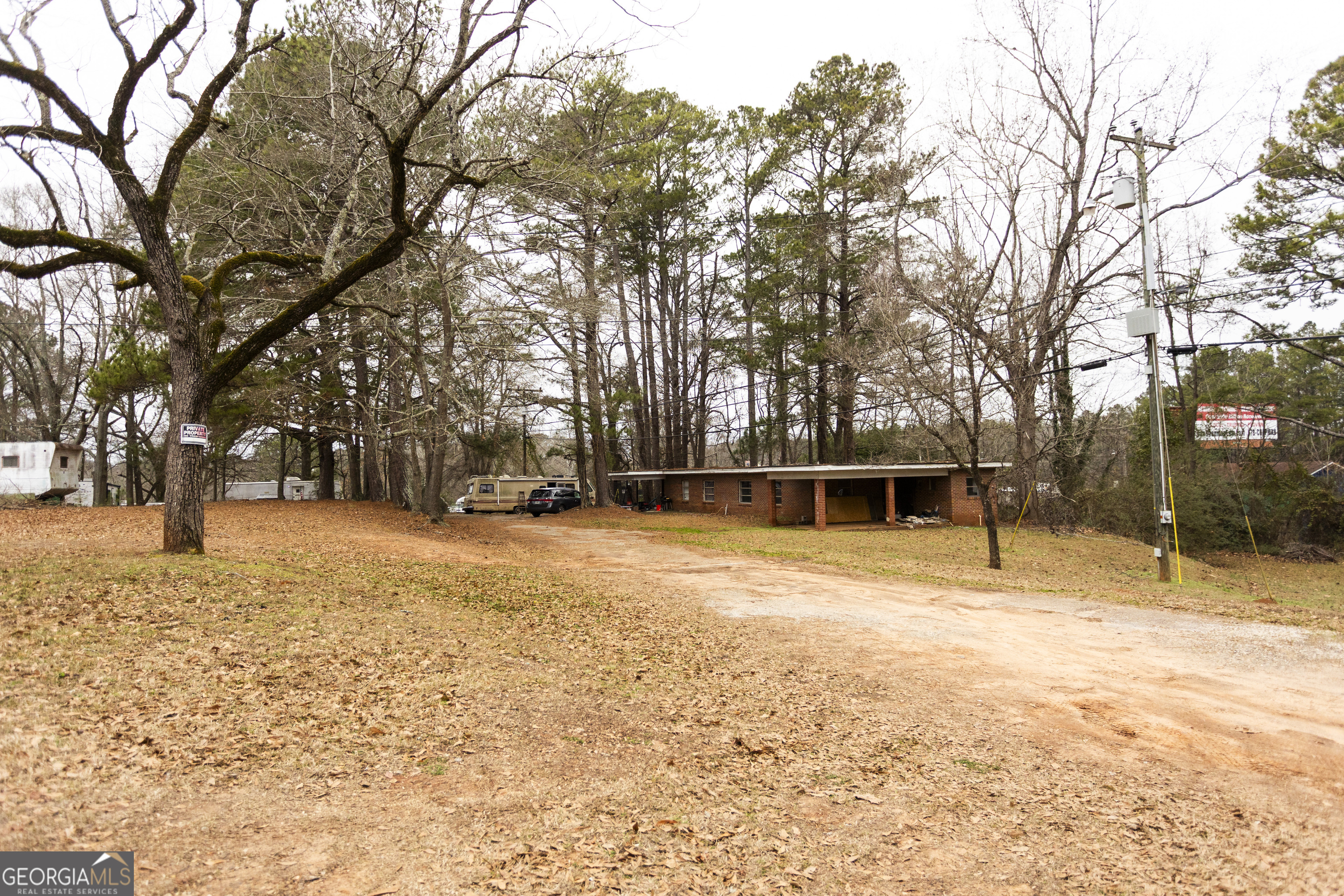 20 East Dollar Circle Covington, GA 30014 - Photo 14 of 31 a house with trees in front of it