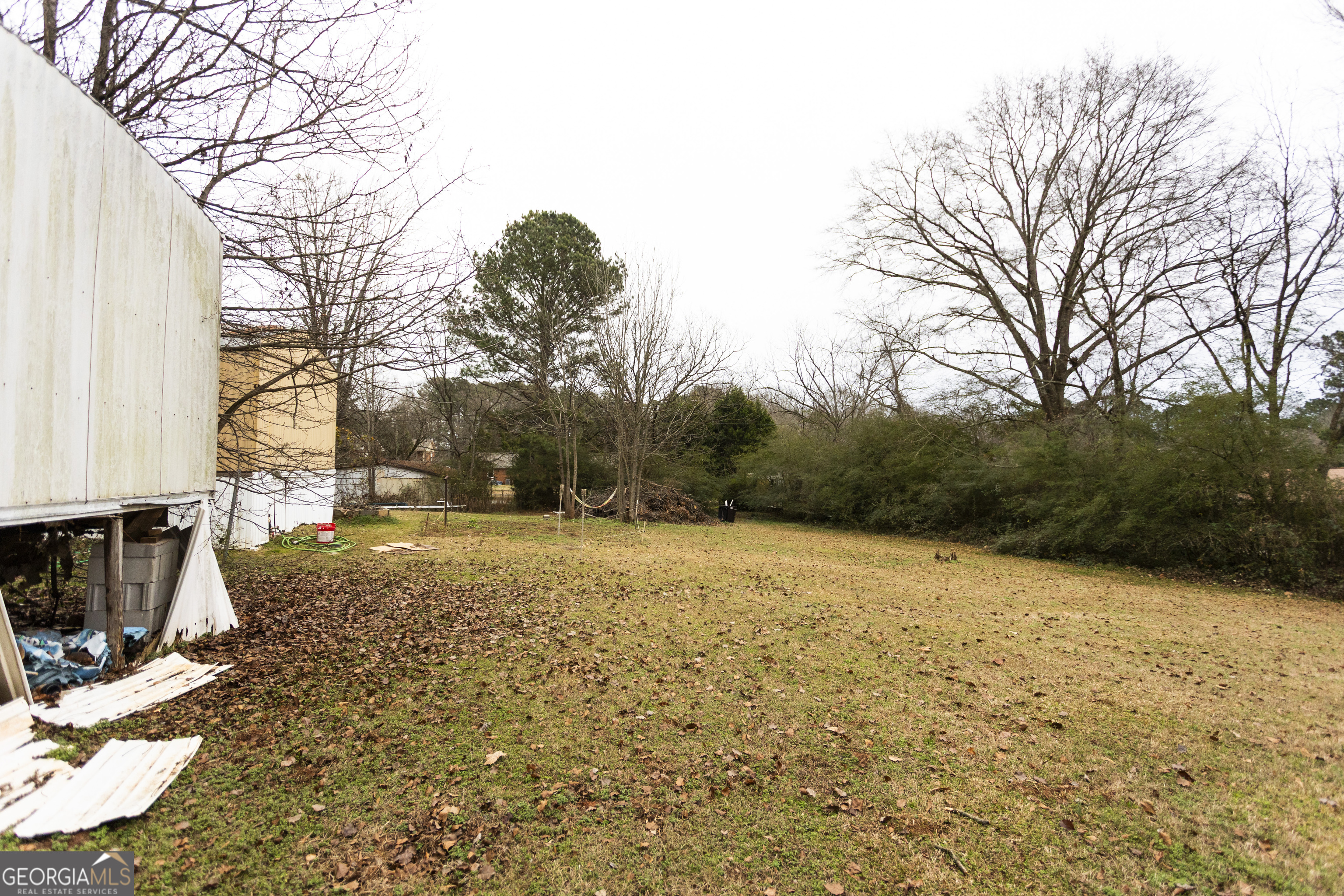 20 East Dollar Circle Covington, GA 30014 - Photo 18 of 31 a view of outdoor space with deck and trees
