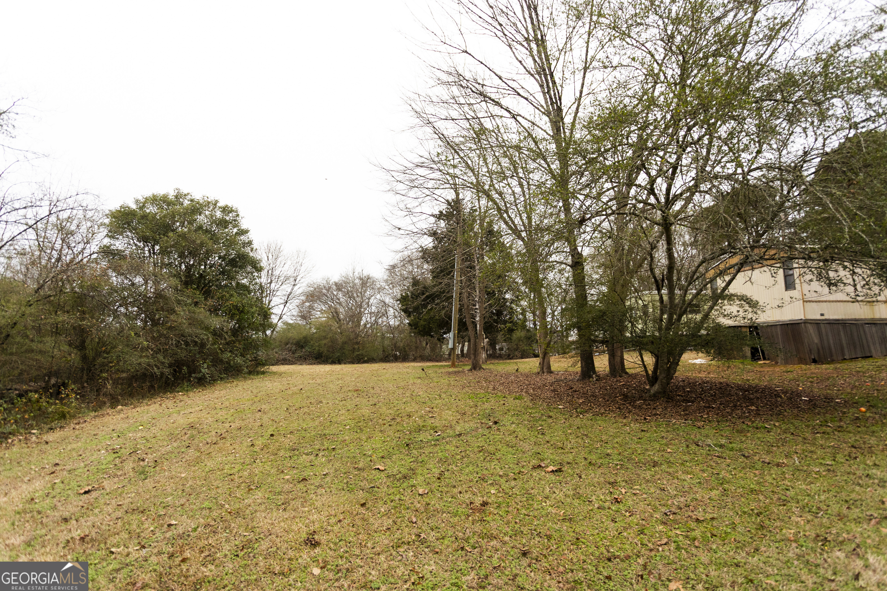 20 East Dollar Circle Covington, GA 30014 - Photo 20 of 31 a view of swimming pool with a yard