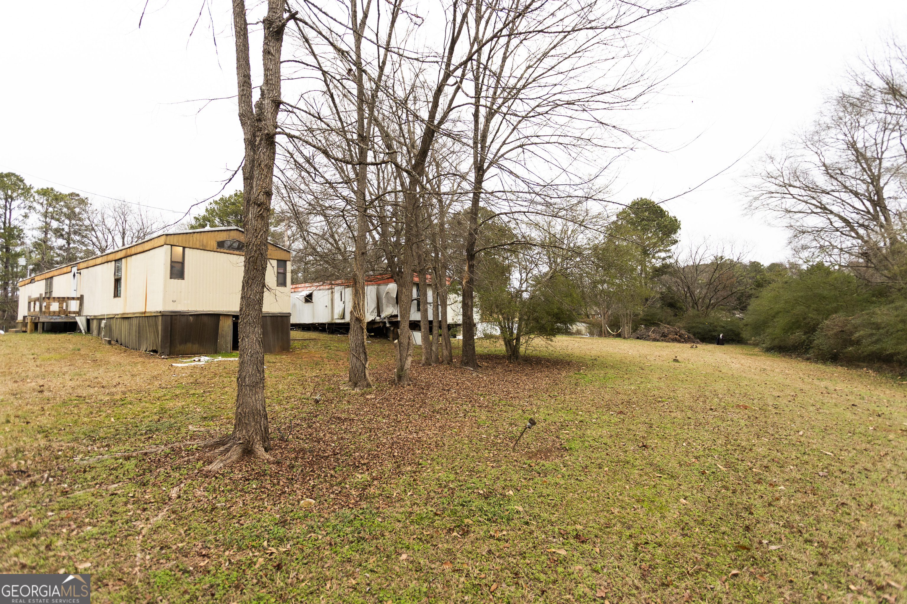 20 East Dollar Circle Covington, GA 30014 - Photo 22 of 31 a street view with large trees