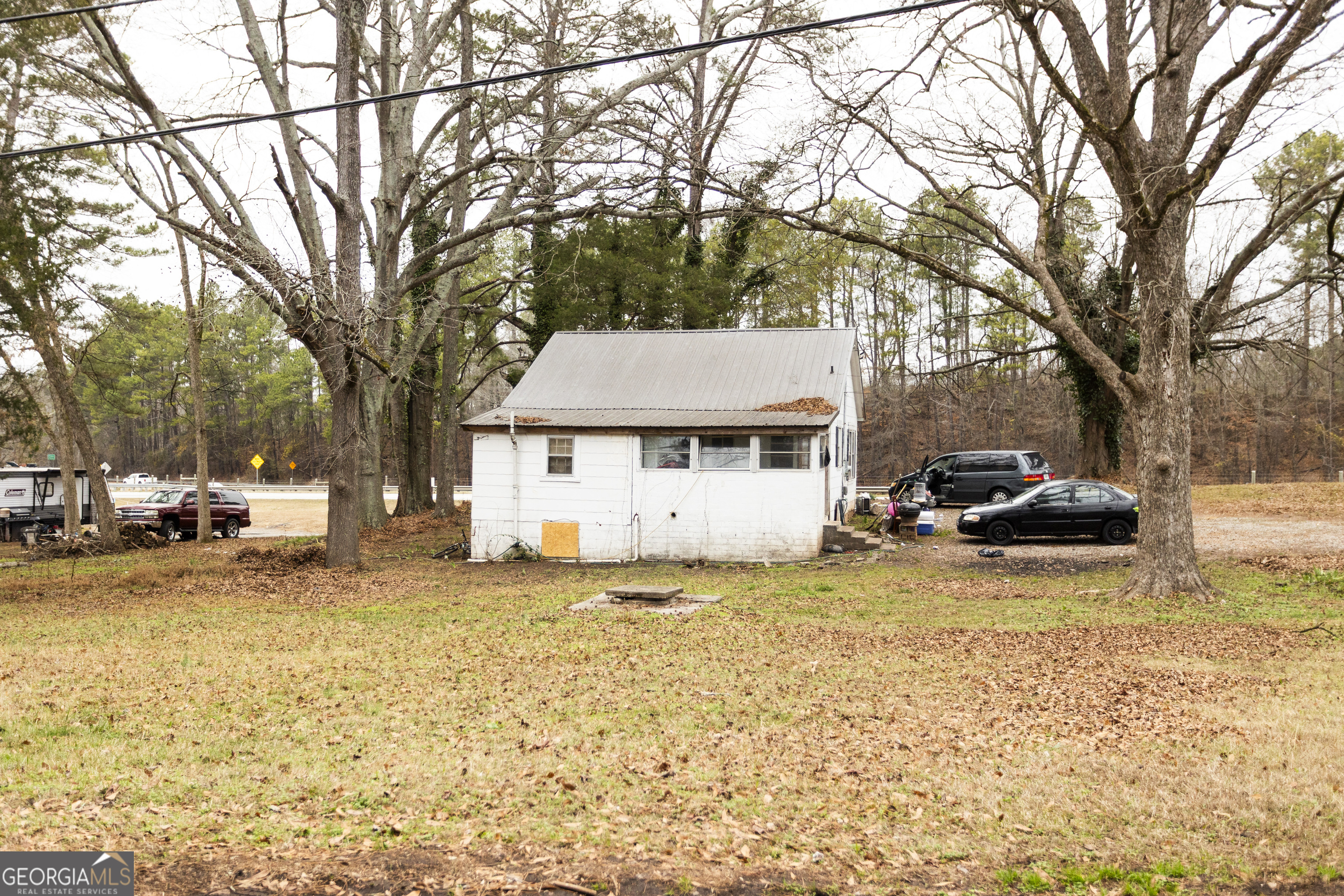 20 East Dollar Circle Covington, GA 30014 - Photo 9 of 31 a view of a house with a yard covered in snow