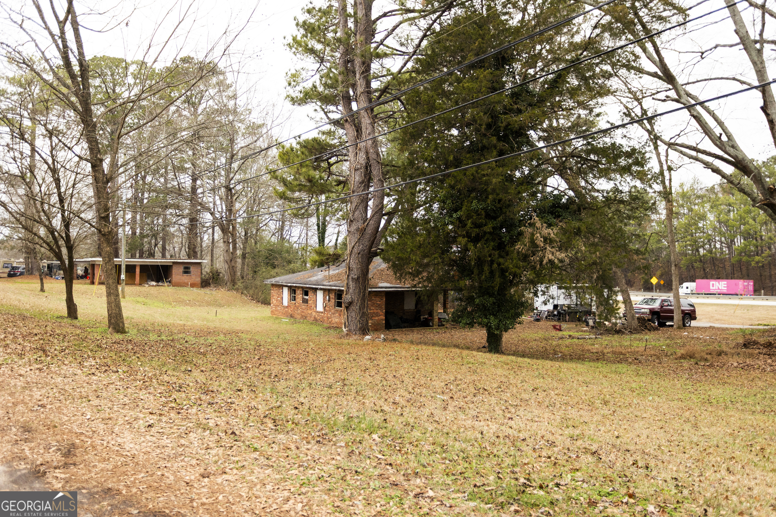 20 East Dollar Circle Covington, GA 30014 - Photo 10 of 31 a view of a yard with a tree