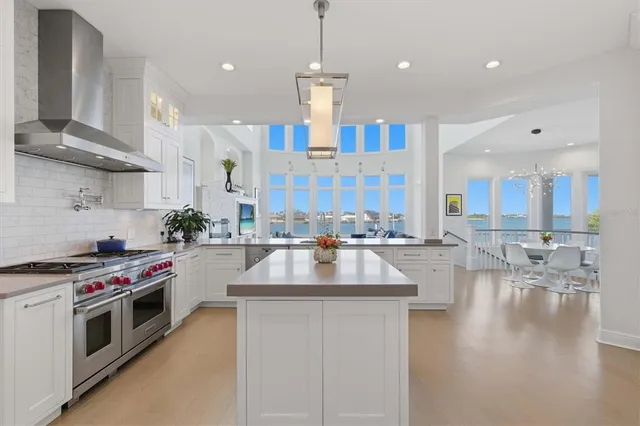 a bathroom with a tub a sink a mirror and a shower