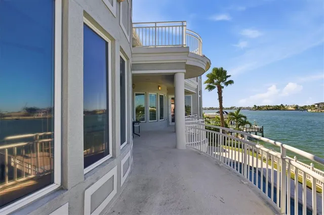 a aerial view of a house with garden space and lake view