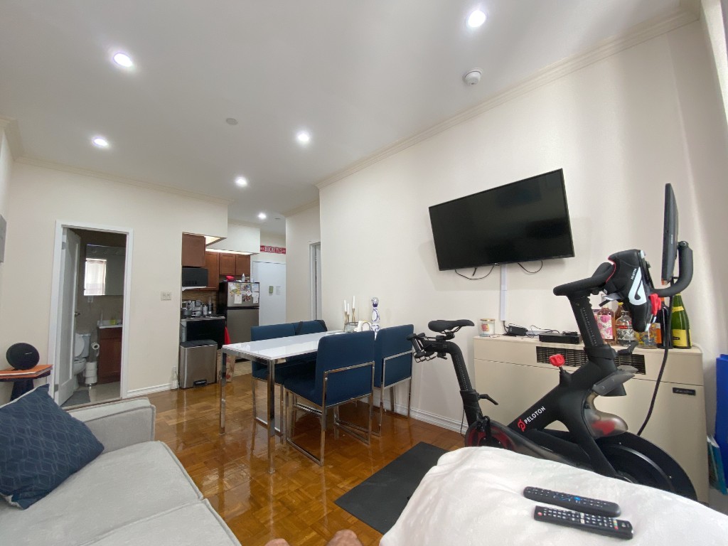 304 West 92nd Street, Unit 4/A Manhattan, NY 10025 - Photo 4 of 15 a living room with furniture and a flat screen tv