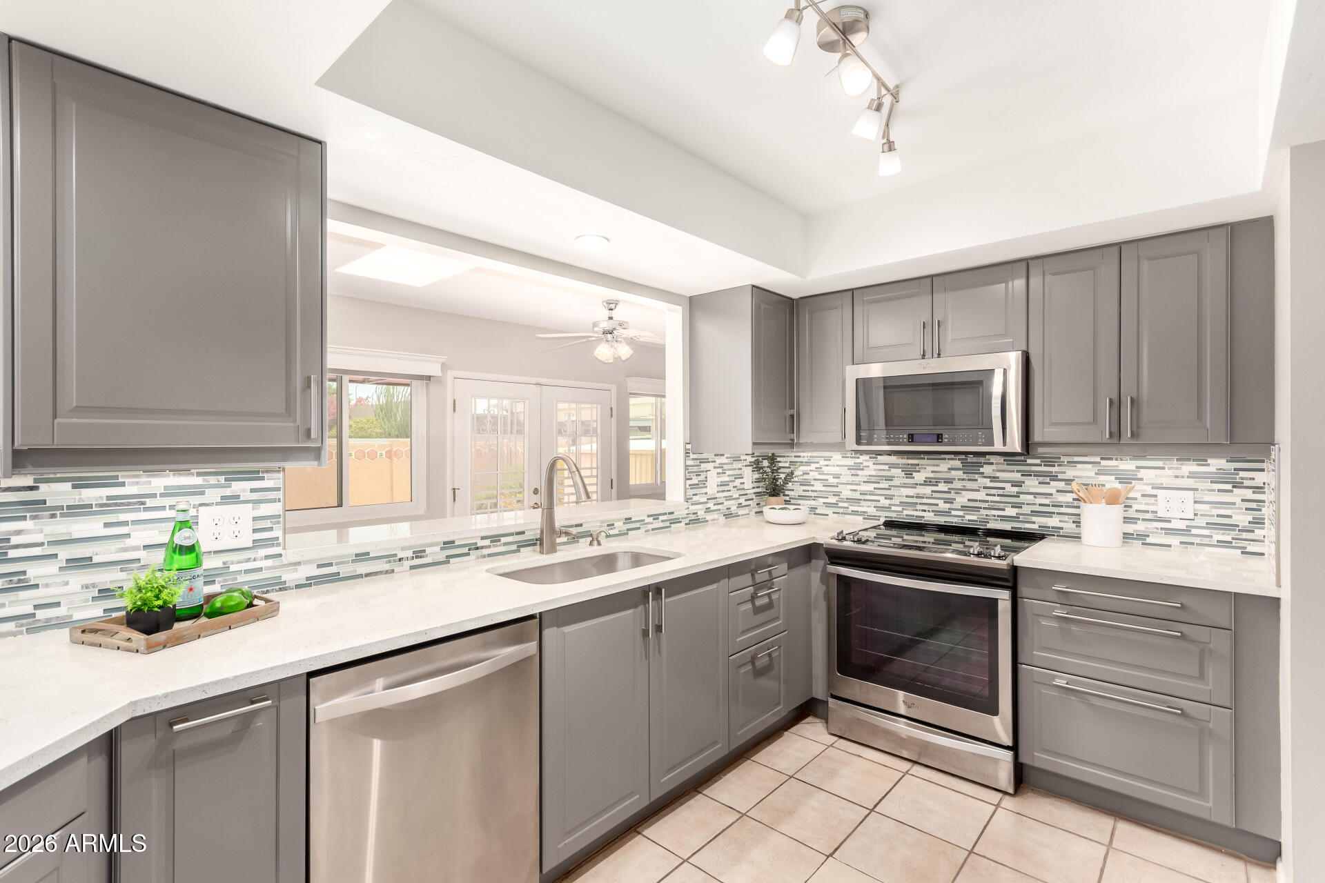 1833 West Citrus Way Phoenix, AZ 85015 - Photo 24 of 36 a kitchen with a sink stove and cabinets