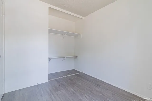 a view of an empty walk in closet