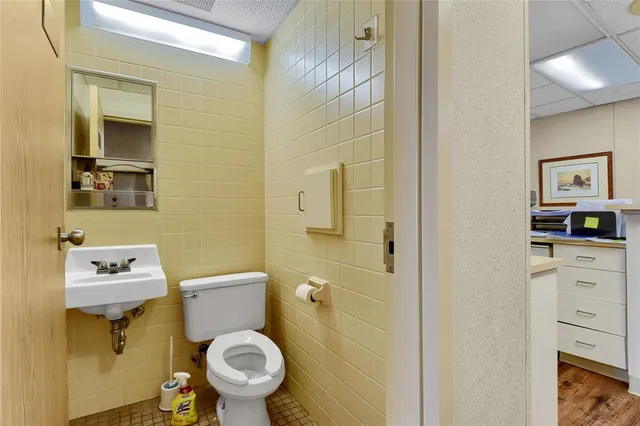 a bathroom with a toilet and a sink