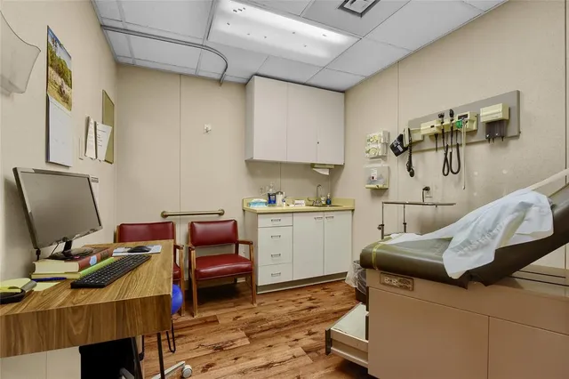 a room with furniture and a workspace