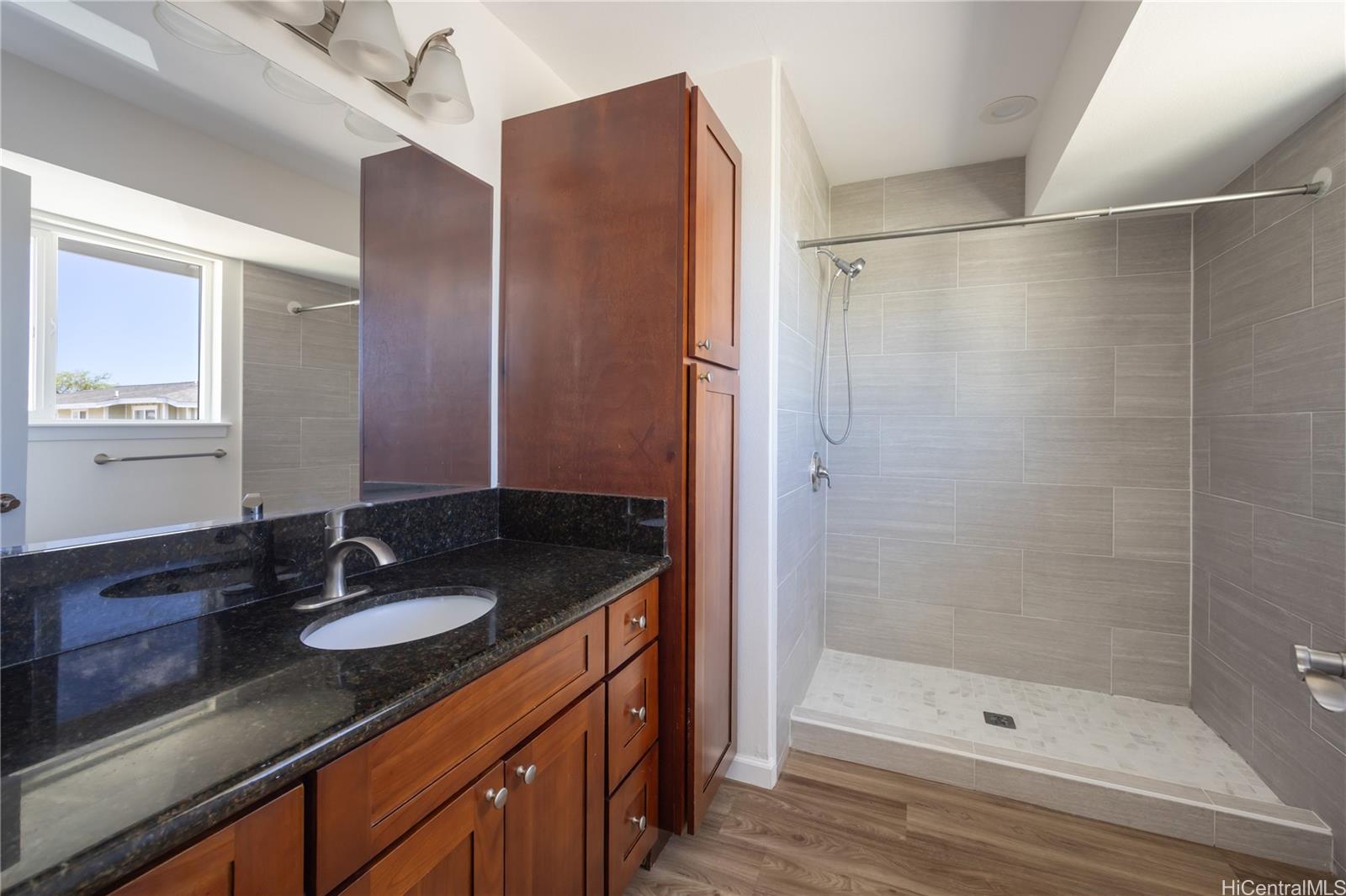 87-176 Maipalaoa Road, Unit Q38 Waianae, HI 96792 - Photo 13 of 18 a bathroom with a sink and a mirror