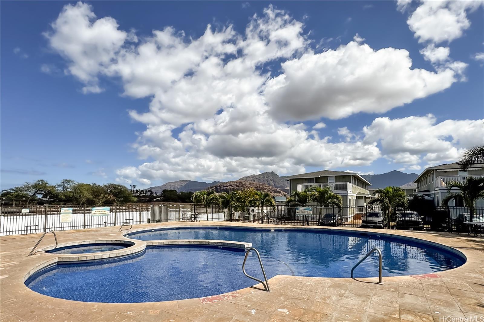 87-176 Maipalaoa Road, Unit Q38 Waianae, HI 96792 - Photo 14 of 18 a view of a swimming pool with a terrace