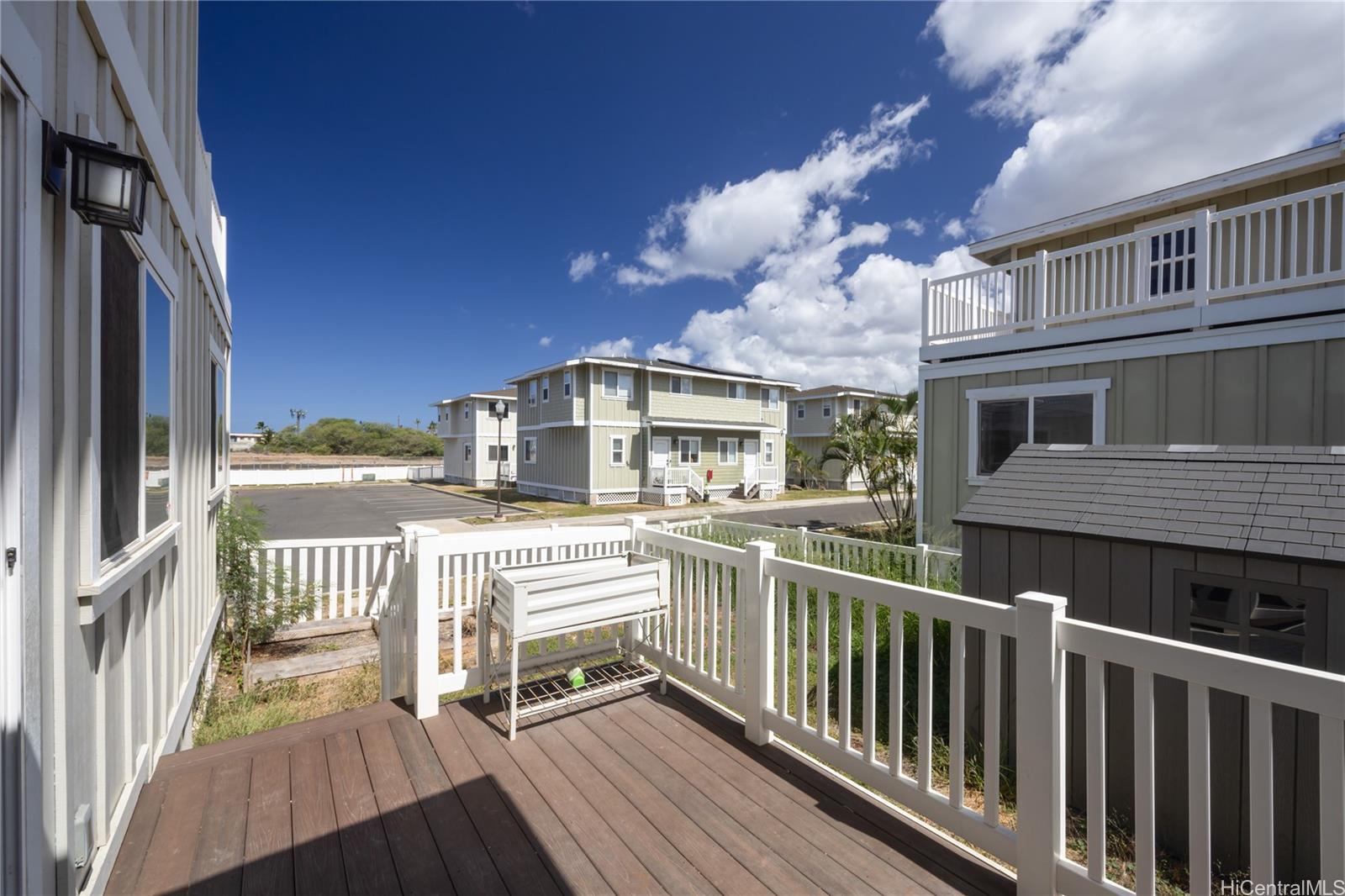 87-176 Maipalaoa Road, Unit Q38 Waianae, HI 96792 - Photo 17 of 18 a view of a house with a wooden deck