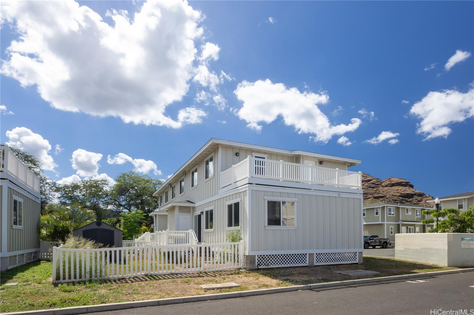 87-176 Maipalaoa Road, Unit Q38 Waianae, HI 96792 - Photo 4 of 18 a front view of a house with a yard