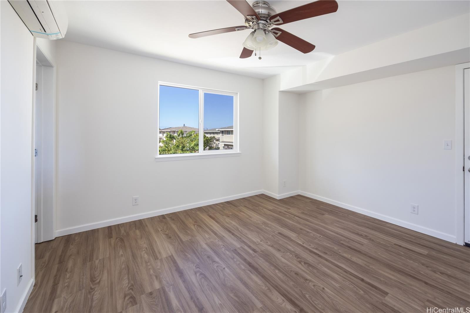 87-176 Maipalaoa Road, Unit Q38 Waianae, HI 96792 - Photo 9 of 18 wooden floor in an empty room with a window