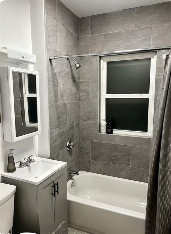 218 Wood Avenue, Unit 1 Boston, MA 02136 - Photo 11 of 11 a bathroom with a sink a toilet and shower