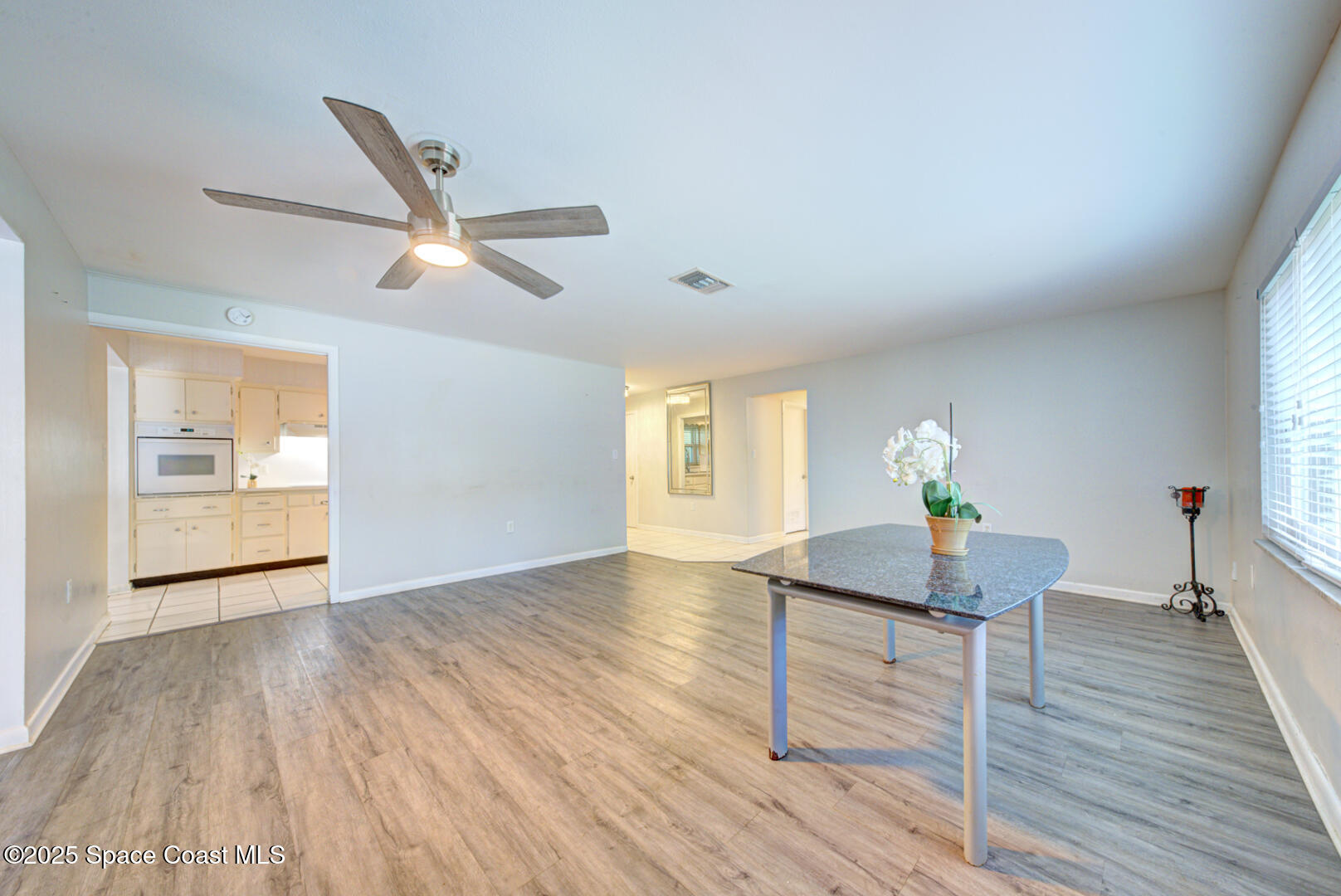 375 Cyprus Drive Cocoa Beach, FL 32931 - Photo 12 of 38 great room with fan