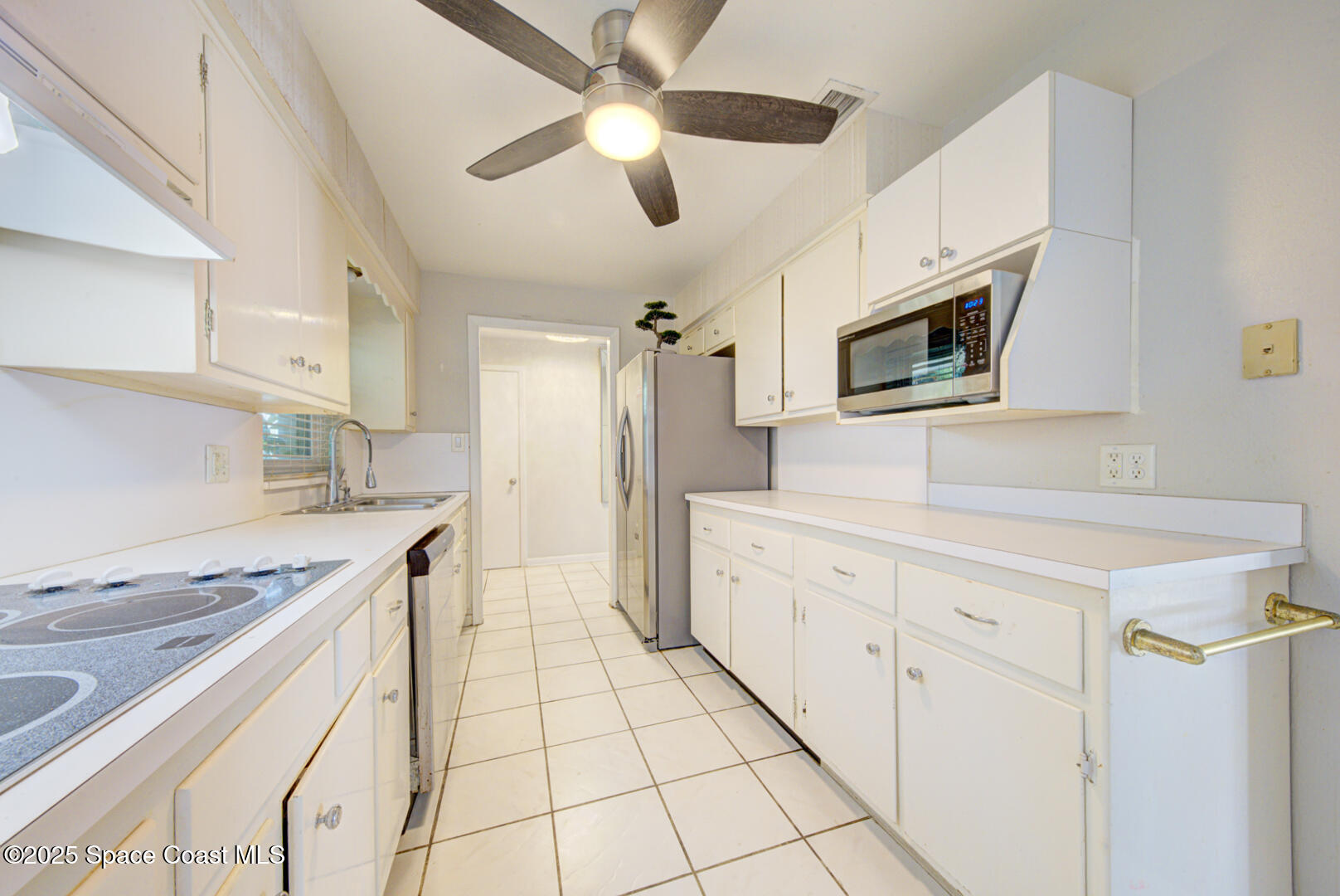 375 Cyprus Drive Cocoa Beach, FL 32931 - Photo 24 of 38 kitchen with fan (2)