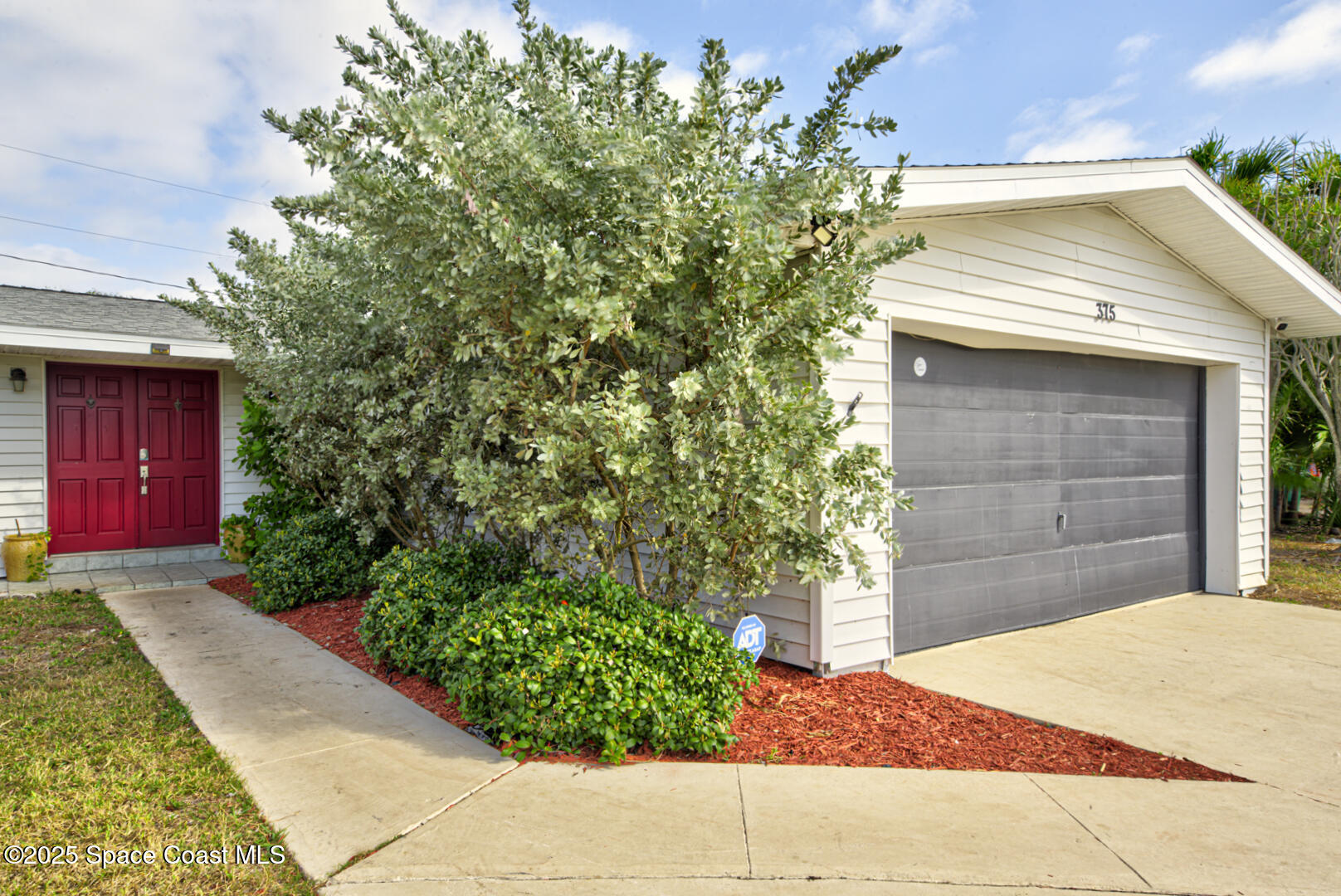 375 Cyprus Drive Cocoa Beach, FL 32931 - Photo 3 of 38 walkway to front door (3)