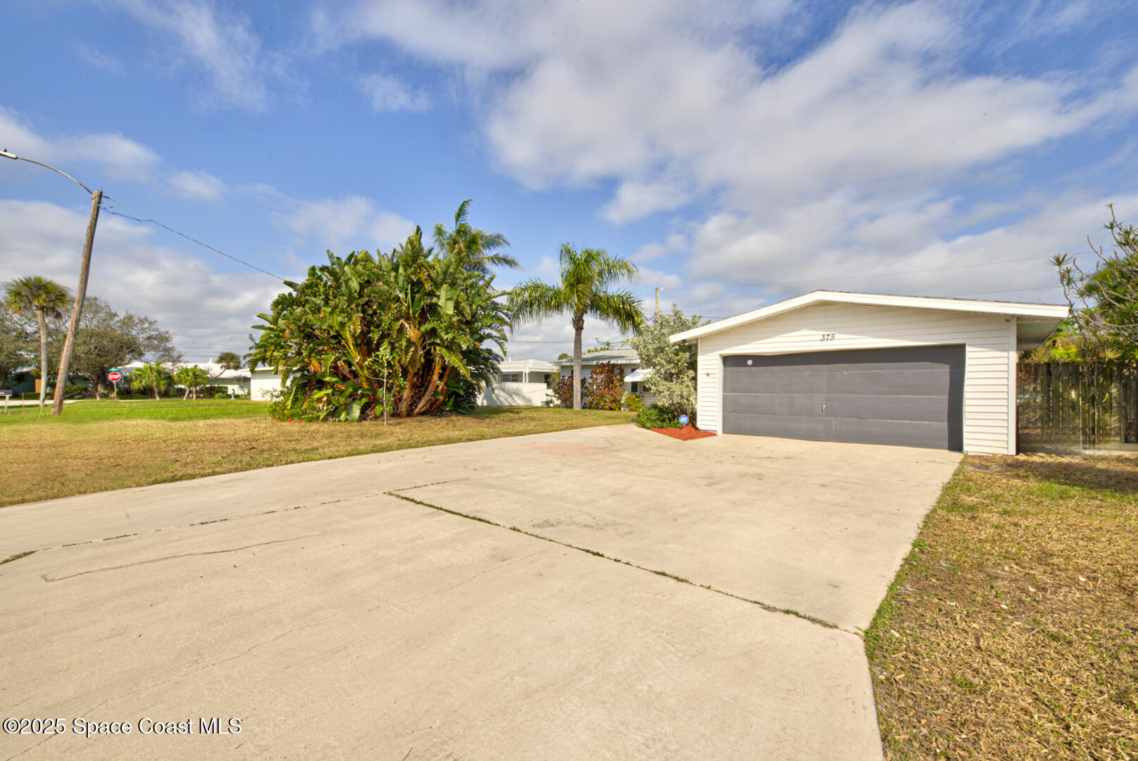 375 Cyprus Drive Cocoa Beach, FL 32931 - Photo 34 of 38 front yard right (5)