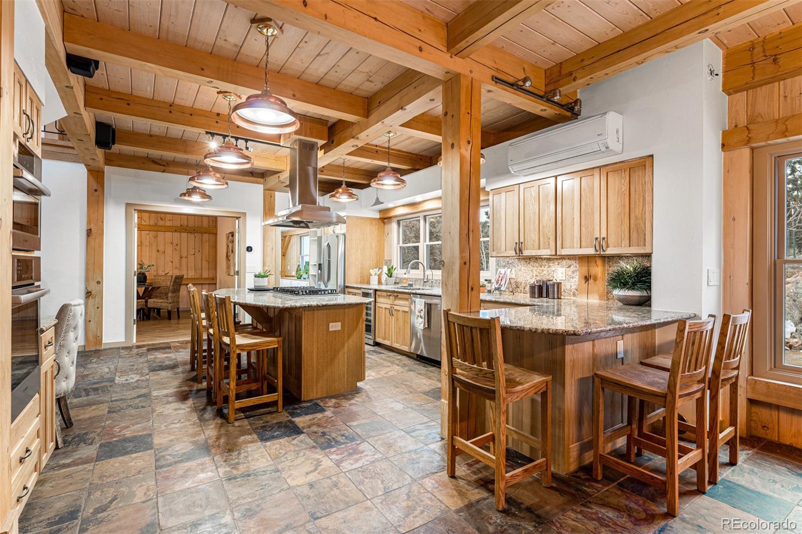 1057 Reed Ranch Road Boulder, CO 80302 - Photo 13 of 40 a view of a dining room with furniture