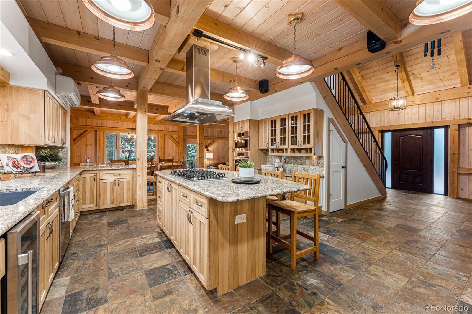 1057 Reed Ranch Road Boulder, CO 80302 - Photo 17 of 40 a kitchen with stainless steel appliances granite countertop a sink and cabinets