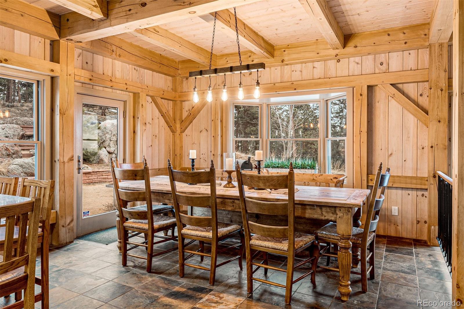 1057 Reed Ranch Road Boulder, CO 80302 - Photo 20 of 40 a view of an outdoor dining space with a table and chairs