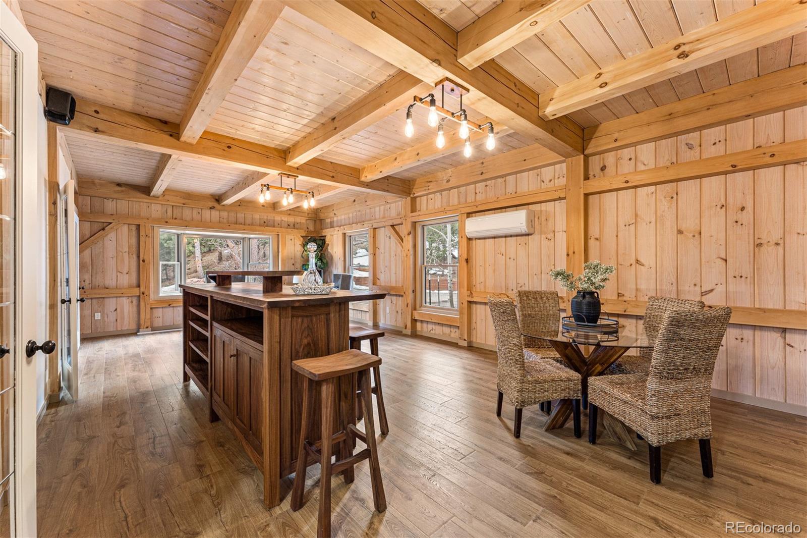 1057 Reed Ranch Road Boulder, CO 80302 - Photo 21 of 40 a view of a dining room with furniture and wooden floor