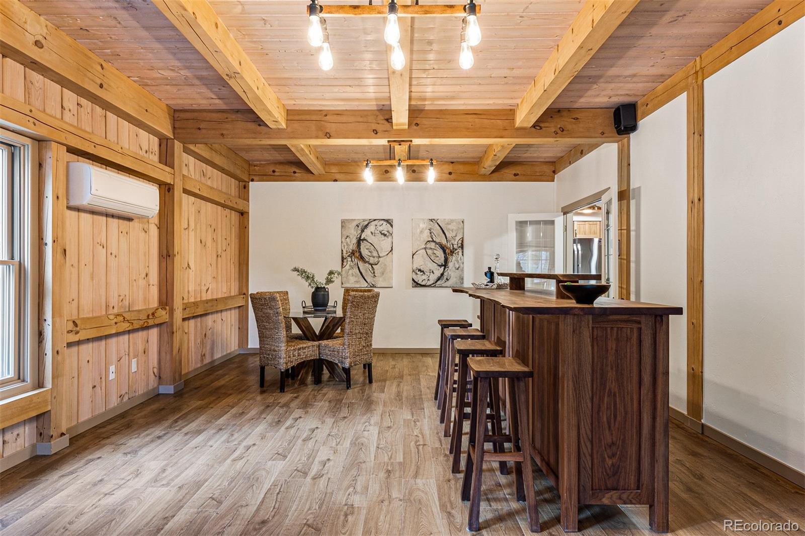 1057 Reed Ranch Road Boulder, CO 80302 - Photo 23 of 40 a very nice looking room with wooden floor and furniture
