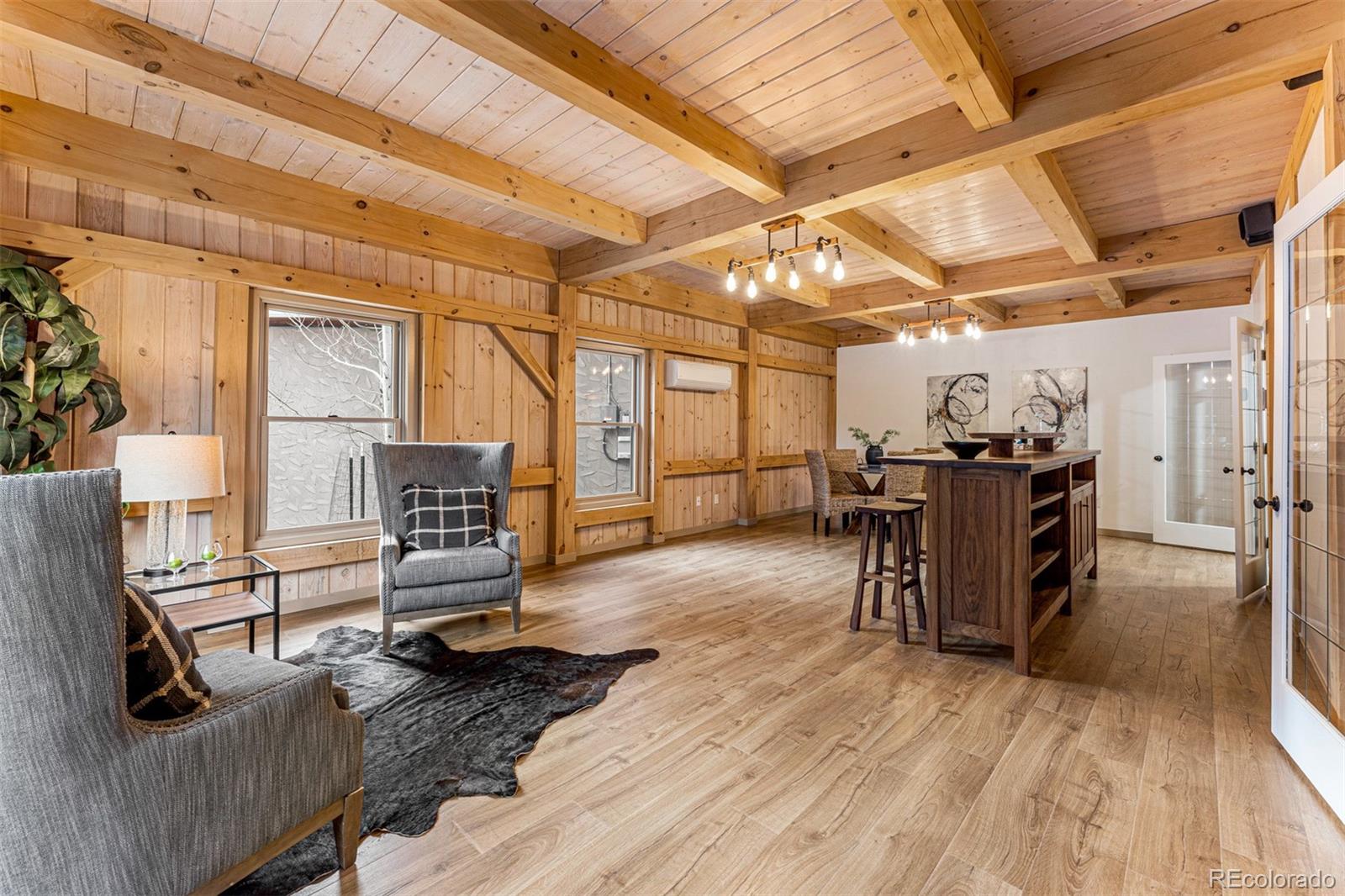 1057 Reed Ranch Road Boulder, CO 80302 - Photo 24 of 40 a view of a livingroom with furniture and a flat screen tv