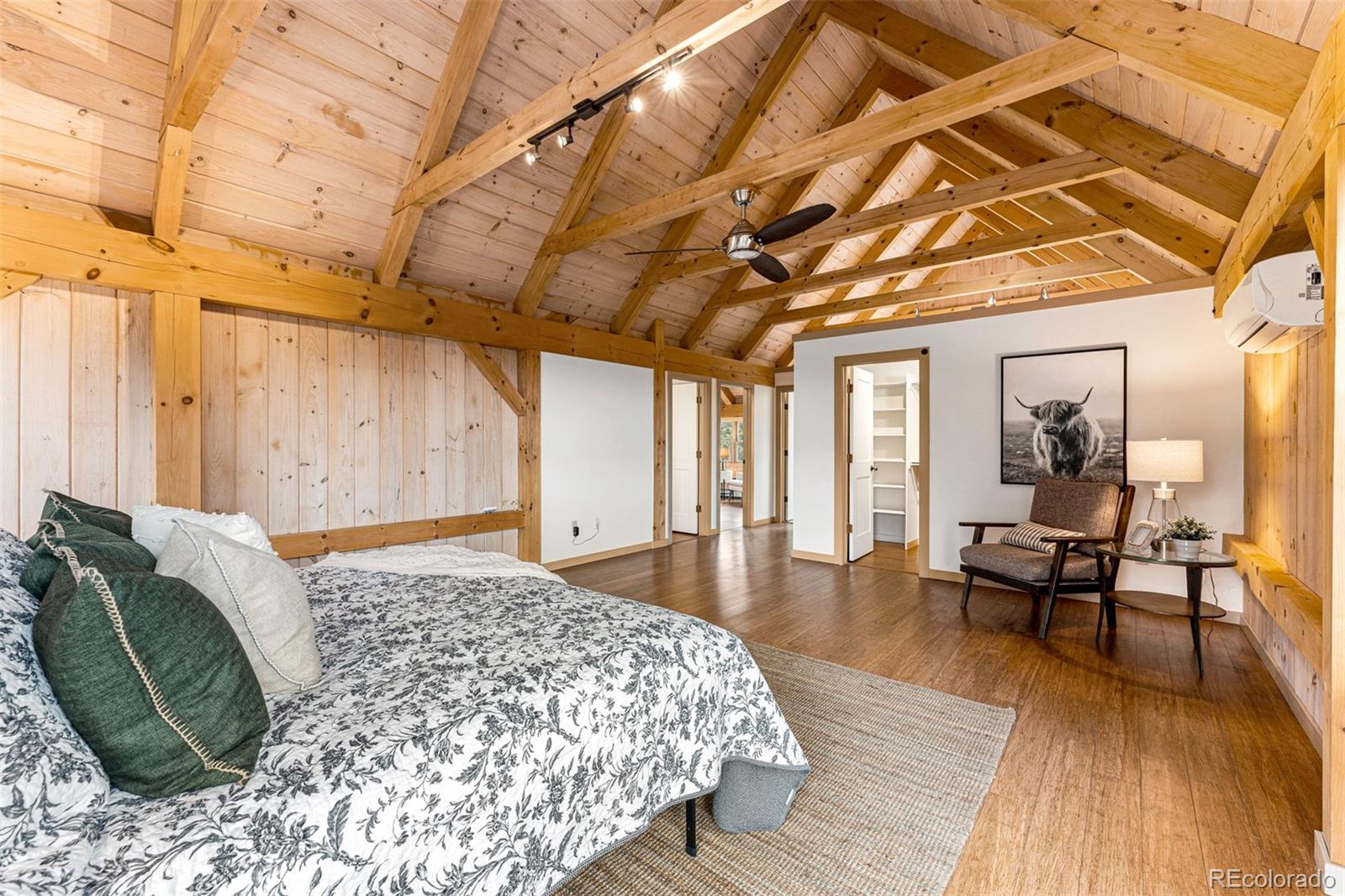 1057 Reed Ranch Road Boulder, CO 80302 - Photo 25 of 40 a living room with furniture and a wooden floor