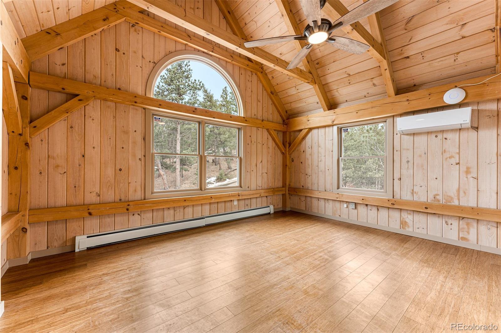 1057 Reed Ranch Road Boulder, CO 80302 - Photo 30 of 40 an empty room with large windows