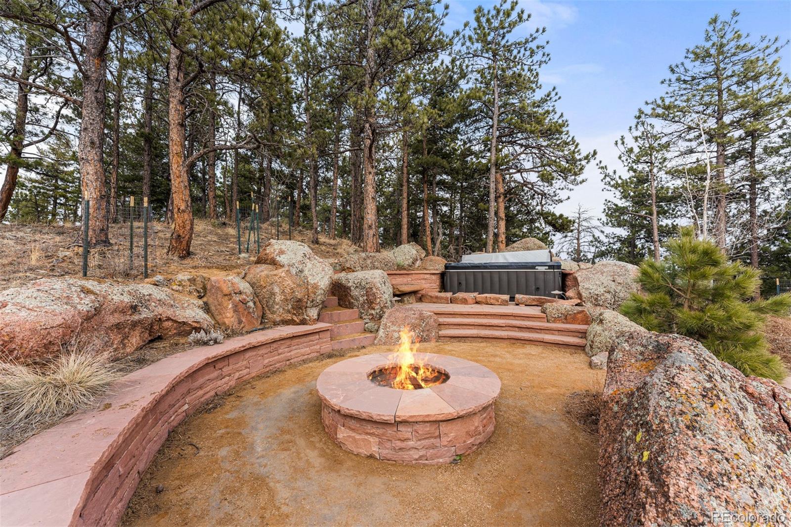 1057 Reed Ranch Road Boulder, CO 80302 - Photo 3 of 40 a view of a swimming pool with a patio