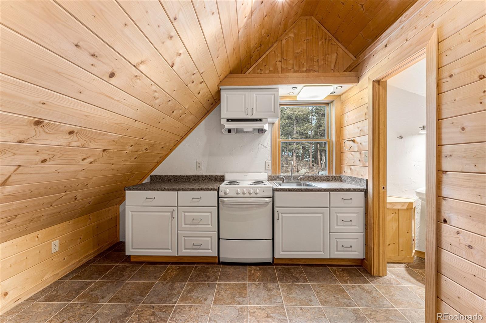 1057 Reed Ranch Road Boulder, CO 80302 - Photo 35 of 40 a view of kitchen with granite countertop cabinets
