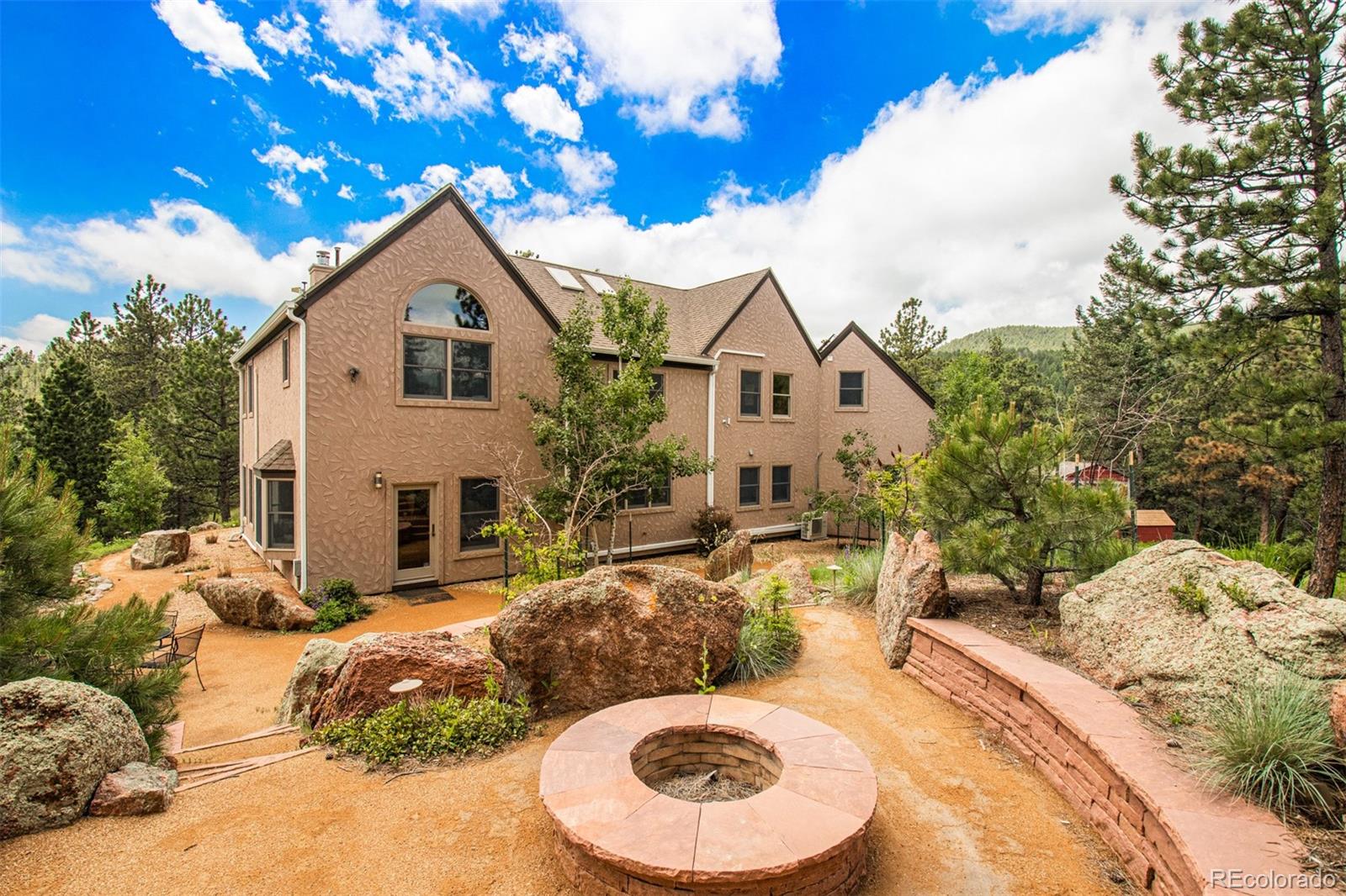 1057 Reed Ranch Road Boulder, CO 80302 - Photo 4 of 40 a view of a house with a yard