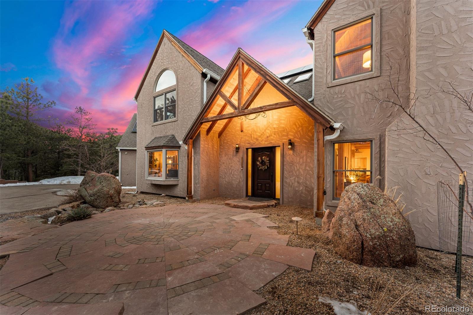 1057 Reed Ranch Road Boulder, CO 80302 - Photo 6 of 40 a view of a house with a yard and garage