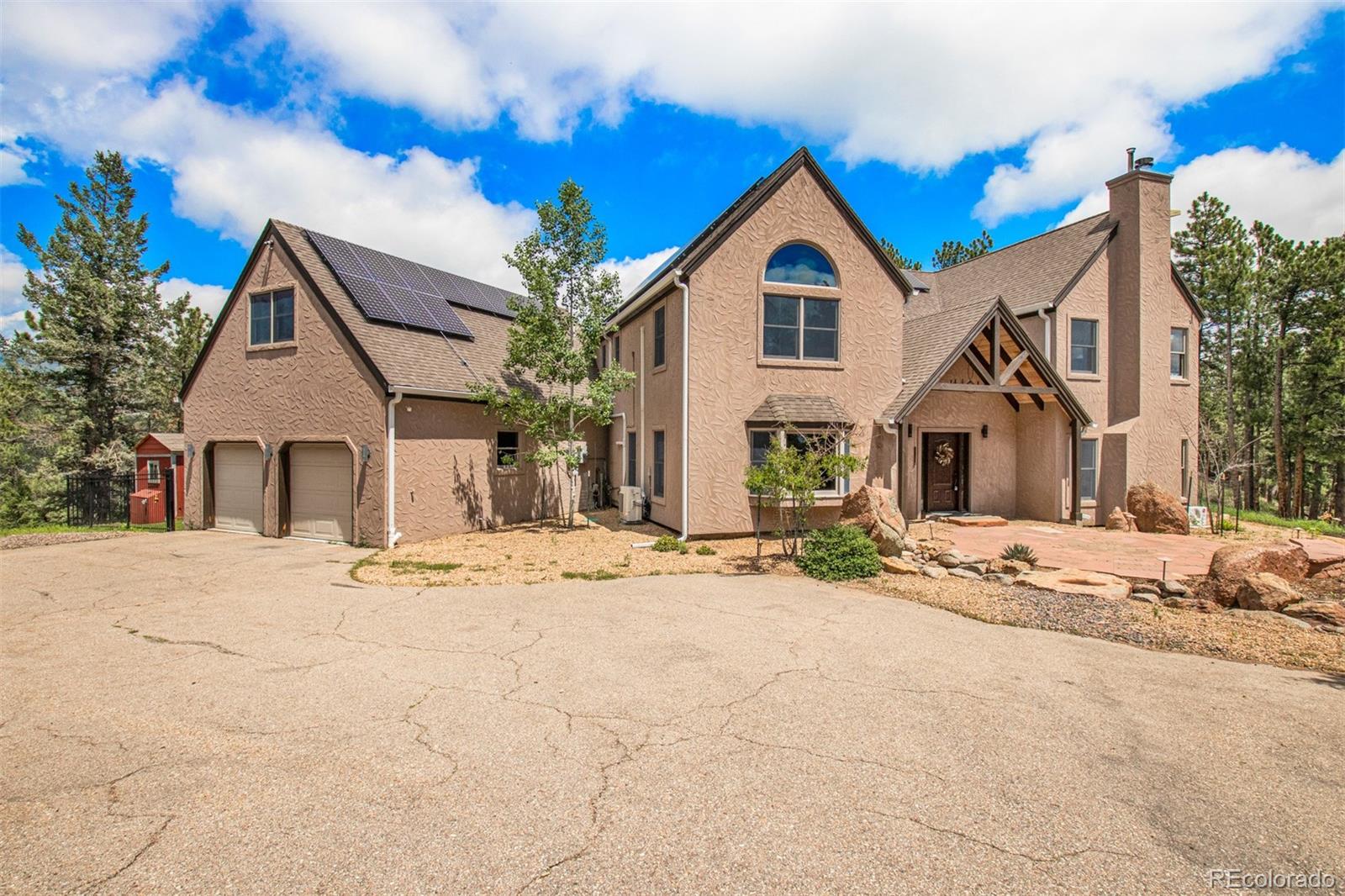 1057 Reed Ranch Road Boulder, CO 80302 - Photo 7 of 40 a view of white house with a yard