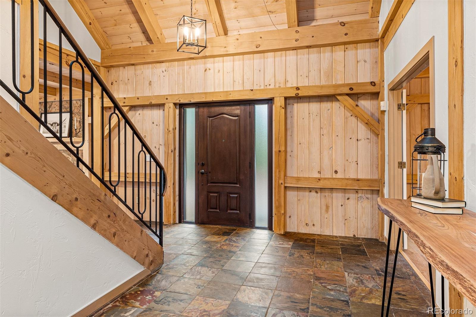 1057 Reed Ranch Road Boulder, CO 80302 - Photo 8 of 40 a view of a kitchen with furniture and staircase