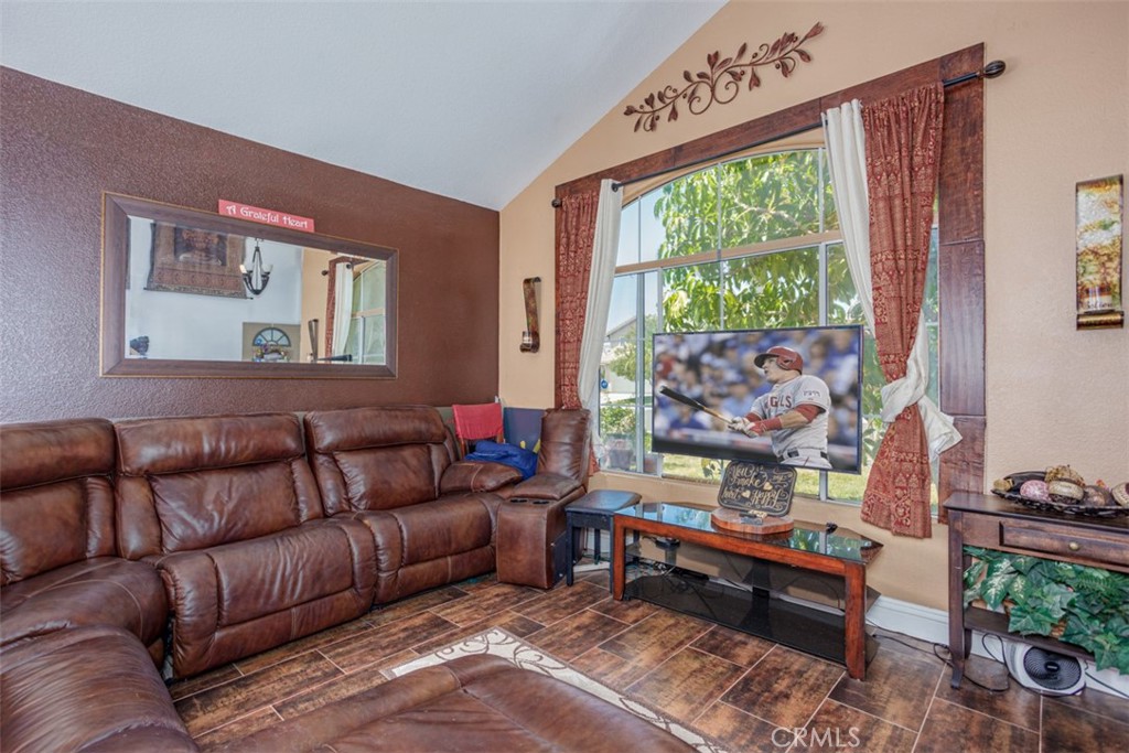 13365 Cloudburst Drive Corona, CA 92883 - Photo 17 of 21 a living room with furniture and a large window