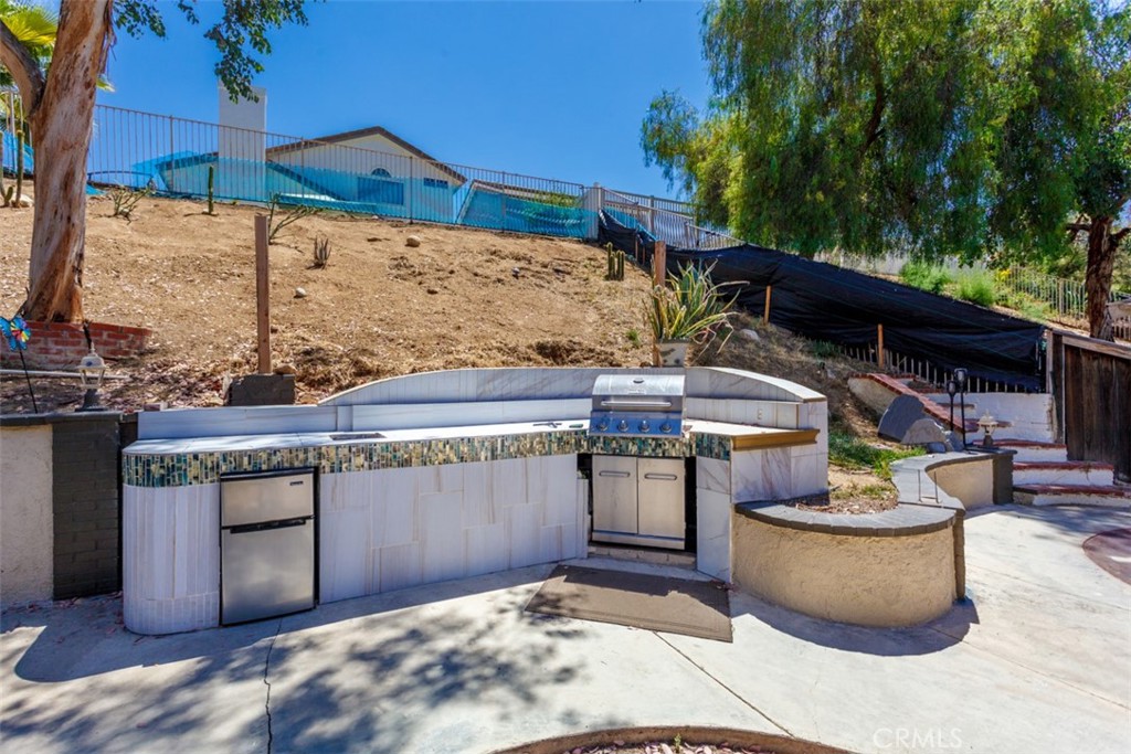 13365 Cloudburst Drive Corona, CA 92883 - Photo 19 of 21 a view of a patio with table and chairs potted plants