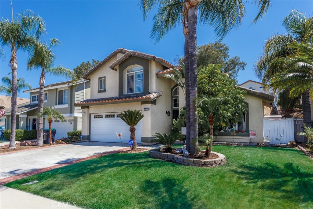 13365 Cloudburst Drive Corona, CA 92883 - Photo 21 of 21 a view of a house with a yard and palm trees