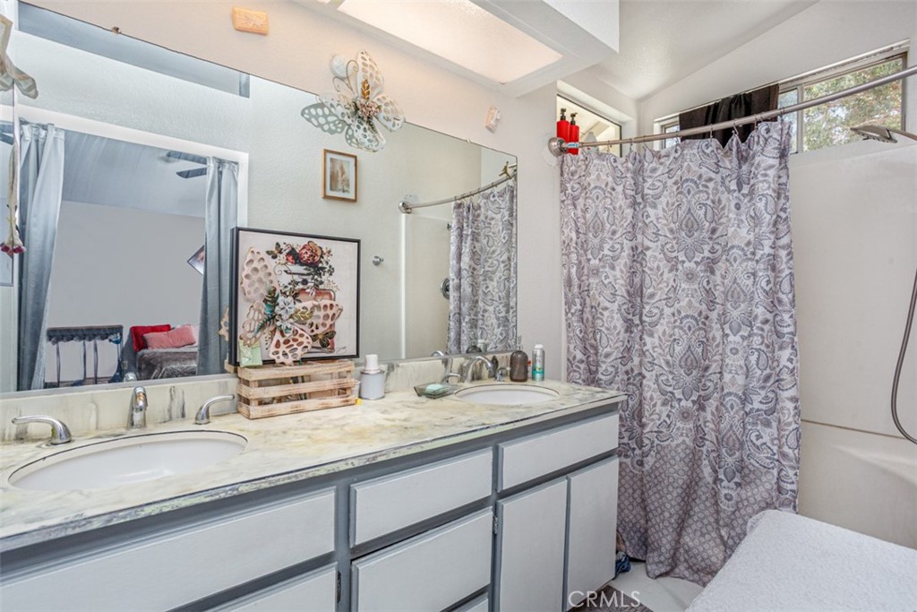 13365 Cloudburst Drive Corona, CA 92883 - Photo 6 of 21 a bathroom with a sink vanity mirror and toilet